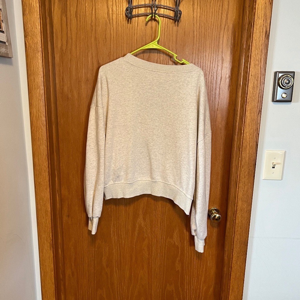 Slouchy sweater with open cross cross back